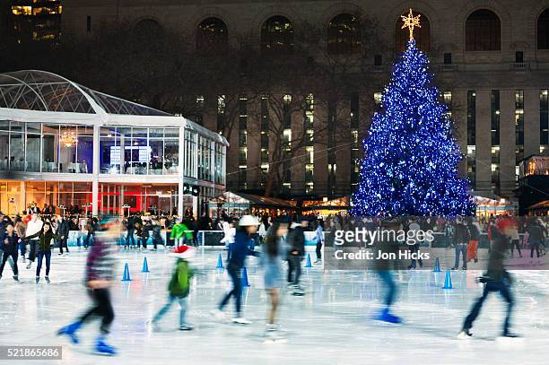 the skating rink in bryant park. - new york city christmas stock pictures, royalty-free photos & images