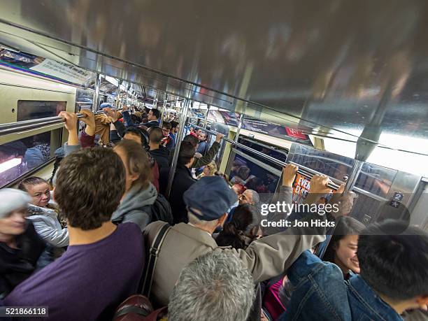 riding the new york city subway. - claustrophobia stock pictures, royalty-free photos & images