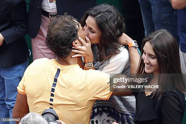 Spain's Rafael Nadal kisses his girlfriend Xisca Perello after winning against France's Gael Monfils in the final tennis match at the Monte-Carlo ATP...