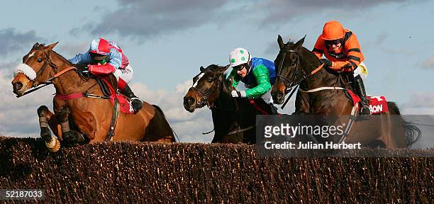 Richard Johnson and Farmer Jack jump the final fence in company with the Timmy Murphy ridden Celestial Gold and the Ruby Walsh partnered Strong Flow...