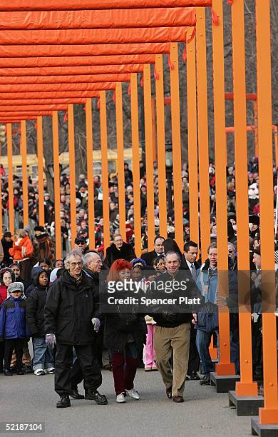 Artists Christo and Jeanne-Claude walk with New York City Mayor Michael R. Bloomberg before unfurling the first gate in the"The Gates, Central Park,...