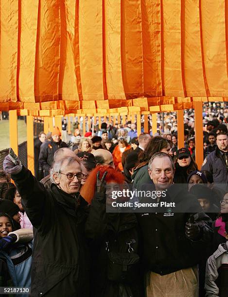 Artists Christo and Jeanne-Claude stand with New York City Mayor Michael R. Bloomberg gesture after the unfurling of the one of the in the "The...