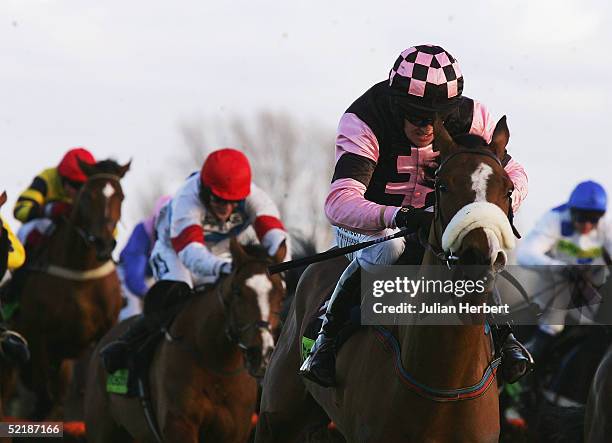 Barry Geraghty and Essex pull away from the last flight to go on and land The totesport Trophy Hurdle Race run at Newbury Racecourse on February 12,...