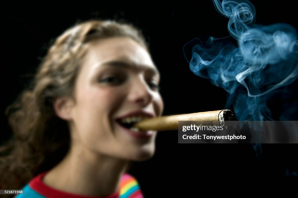 Young Woman Smoking Large Cigar