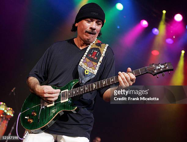 Musician Carlos Santana performs at the Will.I.Am Music Group launch and Tsunami Benefit concert on February 11, 2005 at the Avalon in Hollywood,...