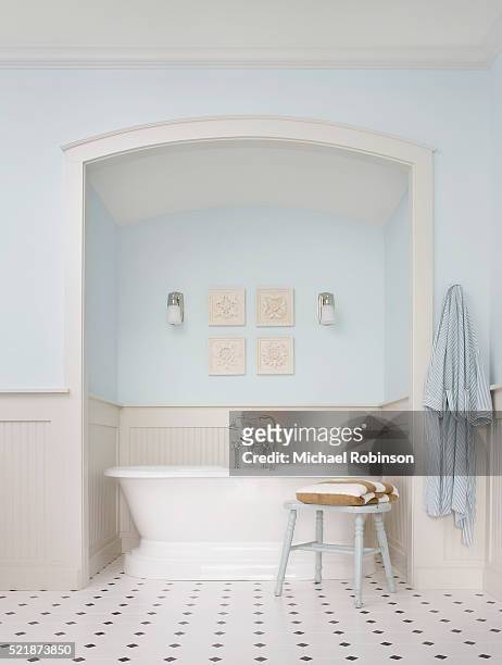 bathtub in alcove - light blue tiled floor stock pictures, royalty-free photos & images