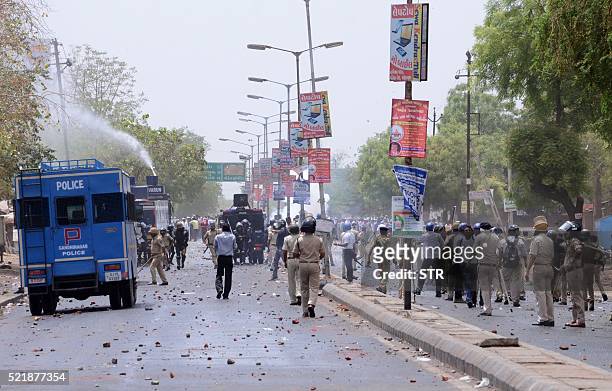Indian supporters of Patel Patidar clash with Gujarat Police at Mehsana, some 70 kms from Ahmedabad on April 17, 2016. Stone-throwing protesters...