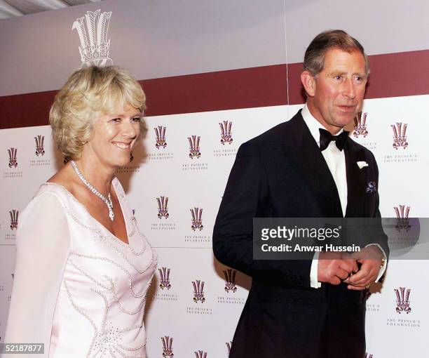 Prince Charles and Camilla Parker-Bowles, with the crown of the Prince's Trust symbol avove her head, attend The Prince's Foundation Gala Dinner on...