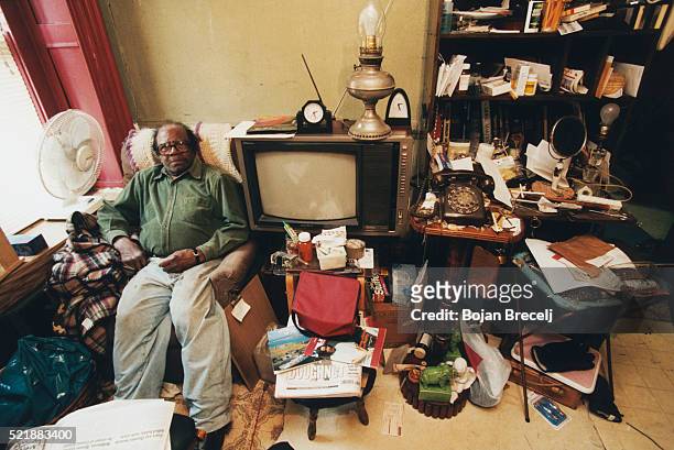 african american man in his harlem apartment - electric fan paper stock pictures, royalty-free photos & images