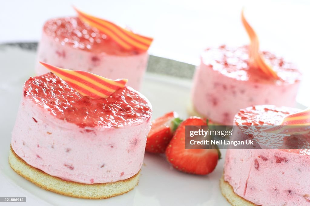 Plated mini strawberry cheesecake dessert