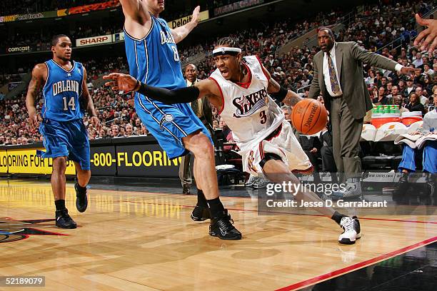 Allen Iverson of the Philadelphia 76ers drives against Pat Garrity of the Orlando Magic on February 12, 2005 at the Wachovia Center in Philadelphia,...