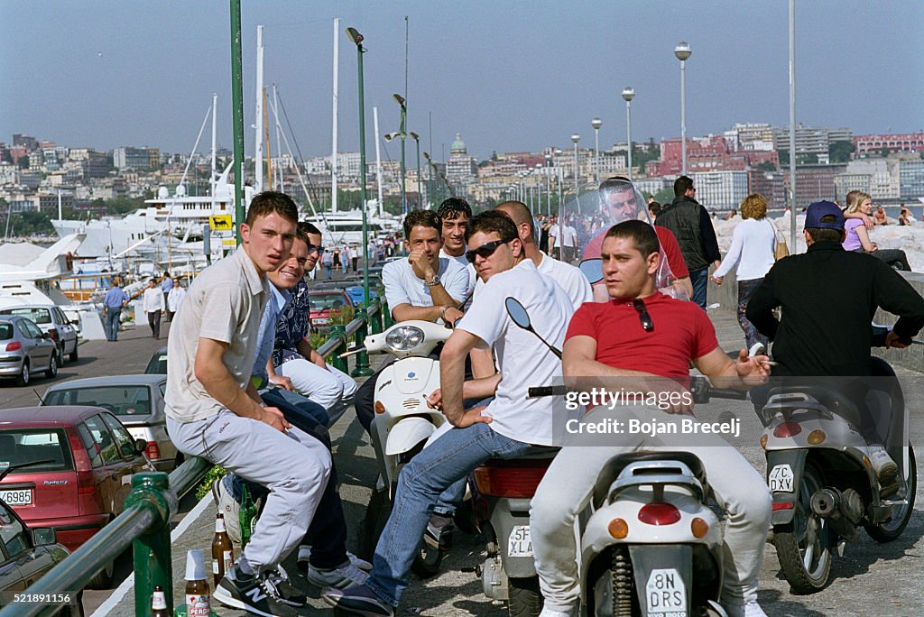 Group of Young Men on Their Vespas