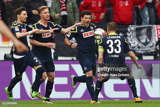 Milos Jojic of Koeln celebrates his team's second goal with team mates during the Bundesliga match between 1. FSV Mainz 05 and 1. FC Koeln at Coface...