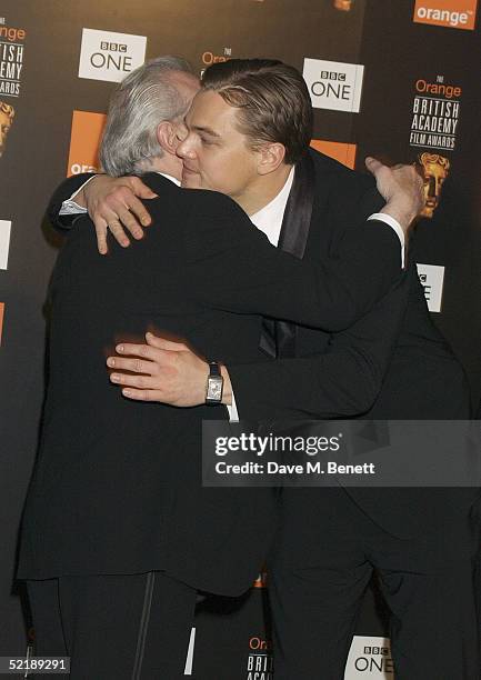 Director Martin Scorsese gets a hug from actor Leonardo DiCaprio in the Awards Room after winning Best Film for "The Aviator" at The Orange British...