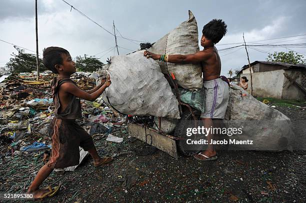 loading recyclable materials on tricycle - philippines tricycle stock pictures, royalty-free photos & images