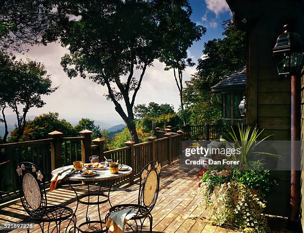 wooden deck with a view on back of house - back deck house stock-fotos und bilder