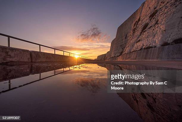 saltdean cliffs, reflection at sunset - saltdean fotografías e imágenes de stock