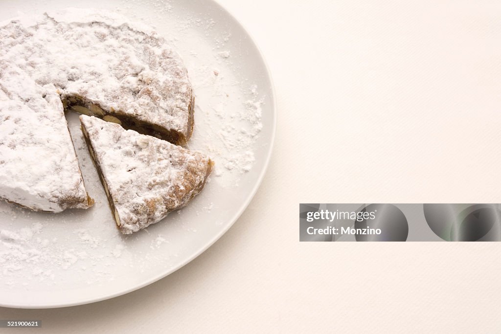 Panforte with a slice of cake on a plate