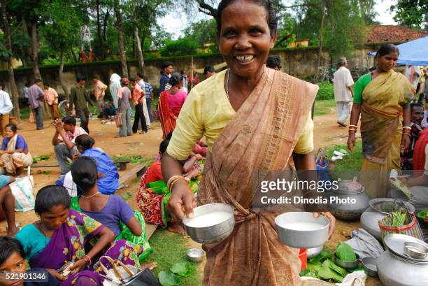 ho tribes woman selling milk in market, chakradharpur, jharkhand, india - chakradharpur stock pictures, royalty-free photos & images