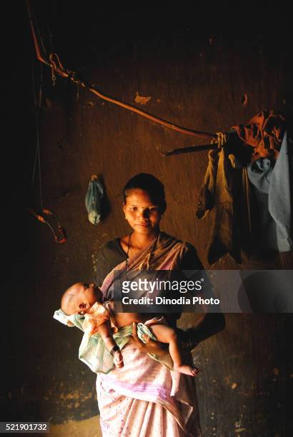 ho tribes woman holding nourished child, chakradharpur, jharkhand, india - chakradharpur stock pictures, royalty-free photos & images