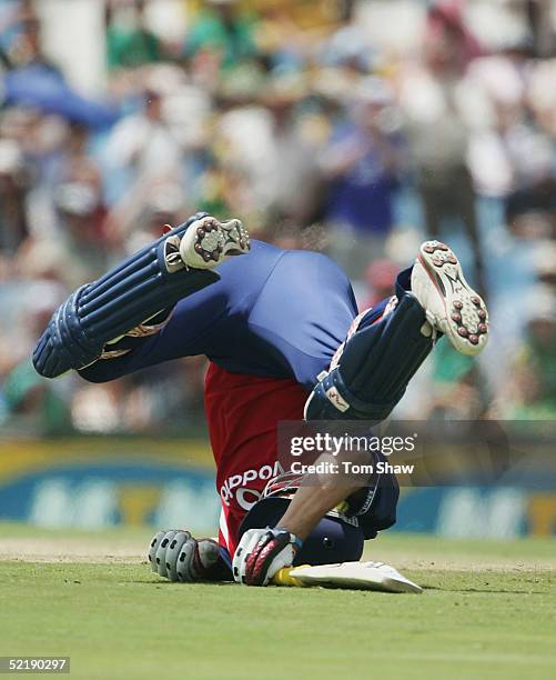 Kevin Pietersen of England rolls on the ground after colliding with Makhaya Ntini of South Africa, during the 7th One Day International between South...