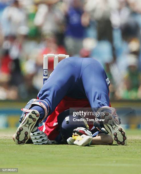 Kevin Pietersen of England rolls on the ground after colliding with Makhaya Ntini of South Africa, during the 7th One Day International between South...