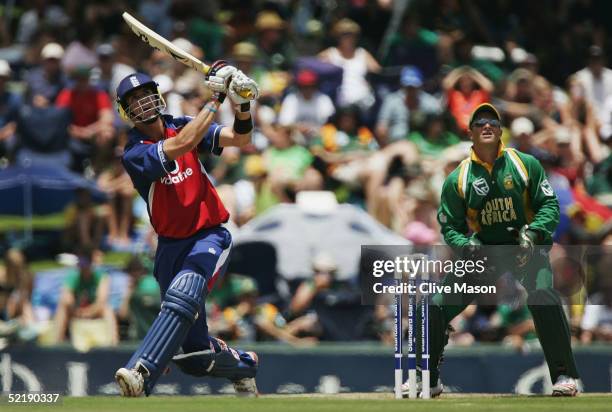 Kevin Pietersen of England on his way to a century watched by Mark Boucher of South Africa, during the seventh and final one day international match...