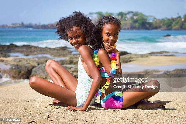 trinidad sisters on tobago beach bathing suits - tobago stock pictures, royalty-free photos & images