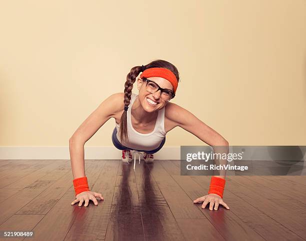 retro female nerd doing pushups - exercise humour stock pictures, royalty-free photos & images