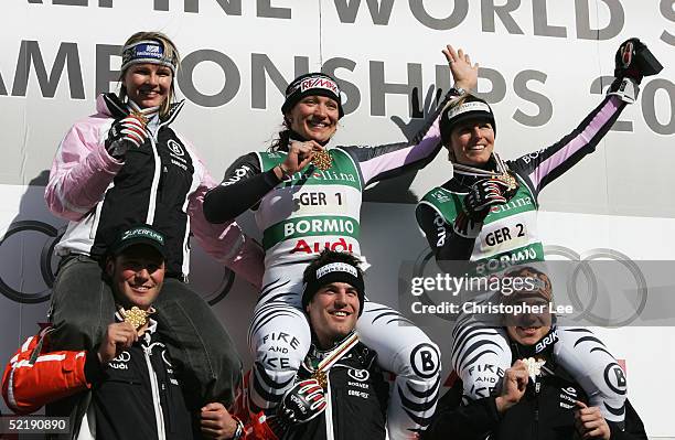 Monika Bergmann-Schmuderer, Martina Ertl , Hilde Gerg , Florian Eckert , Andreas Ertl and Felix Neureuther of Germany celebrate with their gold...