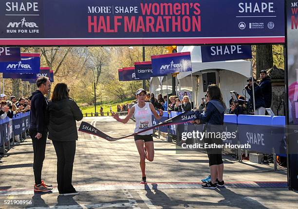 Winner of the 13th Annual MORE/SHAPE Women's Half-Marathon Caroline LeFrak at the finish line at Central Park on April 17, 2016 in New York City.