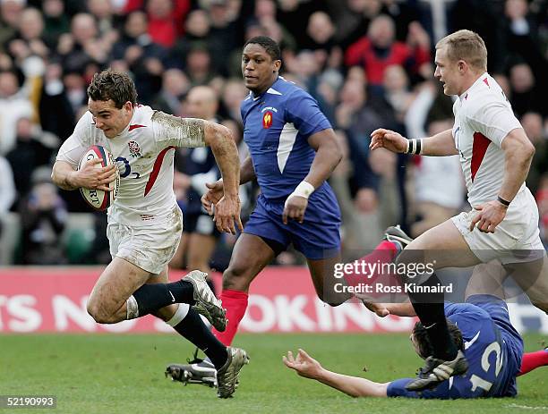Olly Barkley of England breaks away from the French defence to score the first try during the RBS Six Nations International between England and...