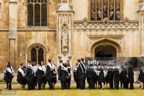 cambridge university students in their gowns, england - cambridge university ストックフォトと画像