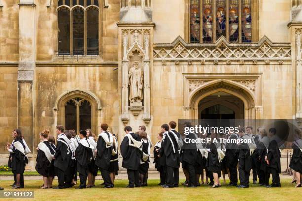 cambridge university students in their gowns, england - cambridge university stock pictures, royalty-free photos & images