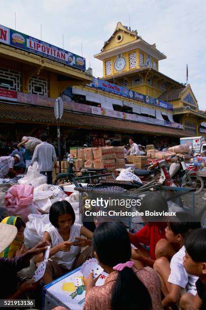 children playing cards outside binh tay market - vietnam girls for sale stock pictures, royalty-free photos & images