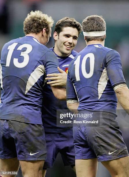 Dimitri Yachvili celebrates with Brian Liebenberg and Yann Delaigue of France during the RBS Six Nations International between England and France at...