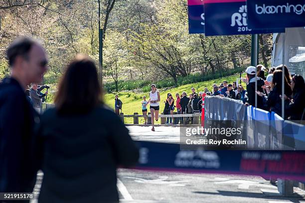 Marathon winner Caroline LeFrak as she crosses the fiinsh line during the 13th annual MORE/SHAPE Women's Half-Marathon at Central Park on April 17,...