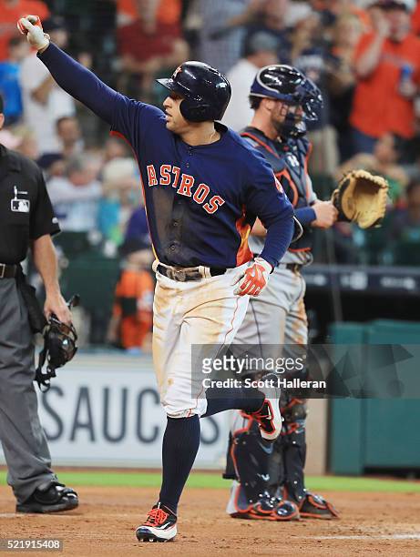 George Springer of the Houston Astros celebrates after hitting a solo home run during the third inning of their game against the Detroit Tigers at...