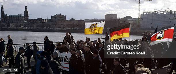 Neo-Nazis march during the 60th anniversary of the fire-bombing of Dresden by Allied bombers during World War II on February 13, 2005 in Dresden,...
