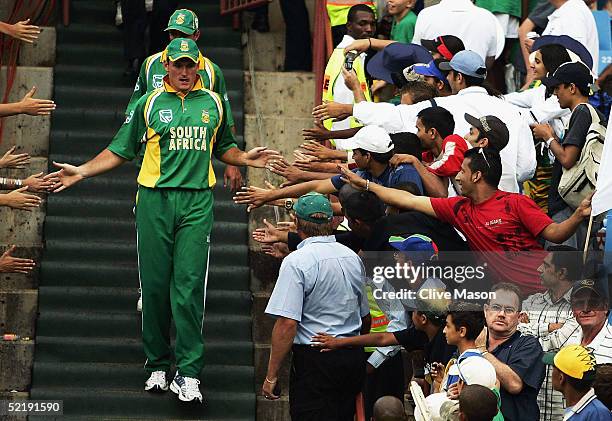 Graeme Smith of South Africa makes his way to the trophy presentation after victory in the seventh and final one day international match between...