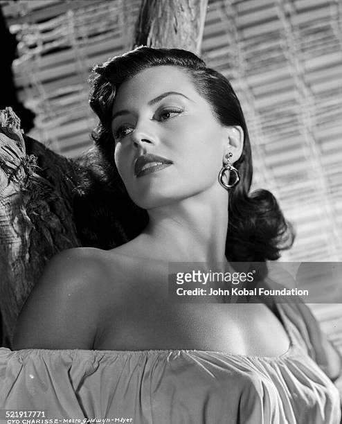 Portrait of actress Cyd Charisse wearing an off the shoulder blouse, for MGM Studios, August 14th 1952.