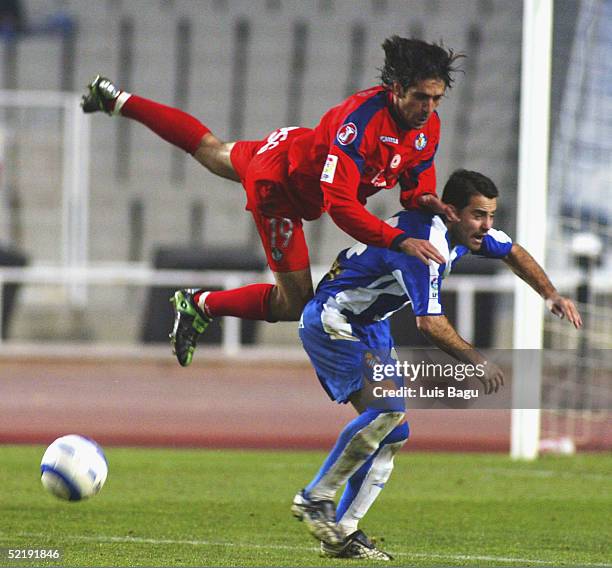 Ito of Espanyol and David Belenguer of Getafe in action during the La Liga match between RCD Espanyol and Getafe at the Montjuic stadium on February...