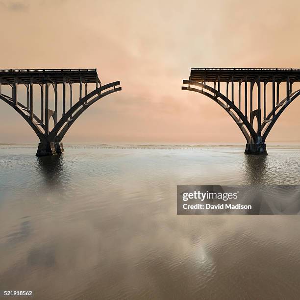 unconnected bridge above water - undone stock pictures, royalty-free photos & images