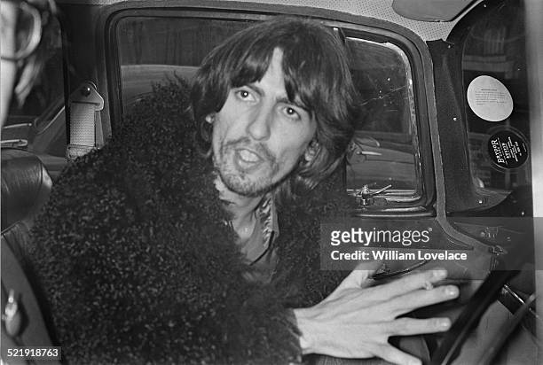 English musician, singer and songwriter George Harrison leaving a recording studio in Twickenham, London, 16th January 1969.