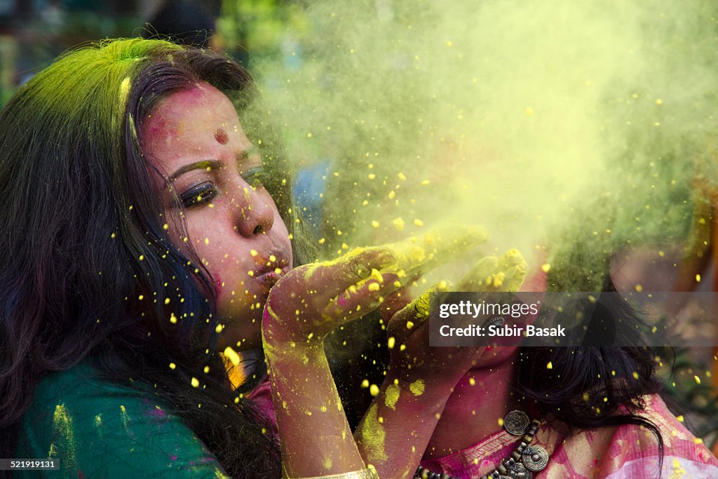 Portrait of an Indian woman celebrating Holi