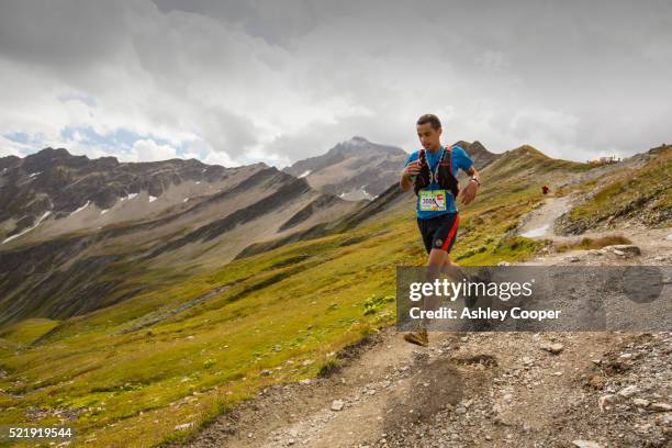 mountain racers undertaking the ultra tour du mont blanc a mountain marathon - ultra marathon stock pictures, royalty-free photos & images