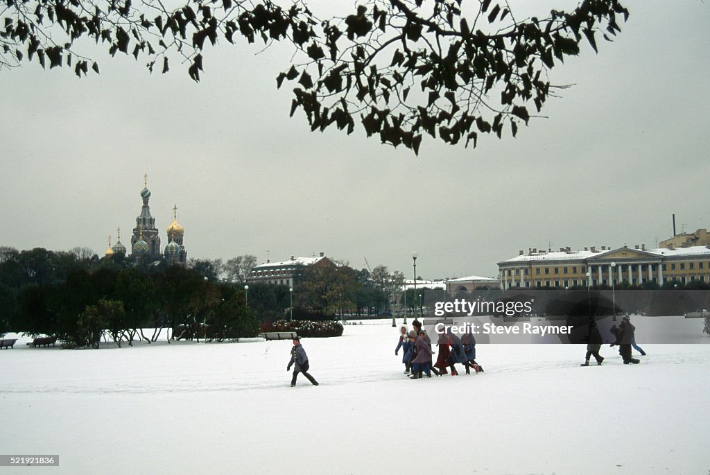 Children Playing in Snowy Park