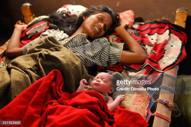 ho tribes woman in pain after delivering baby, chakradharpur, jharkhand, india - chakradharpur stock pictures, royalty-free photos & images