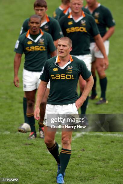 Jaco Pretorius of South Africa leads his team off the field after losing to Samoa in the plate semi-finals of the IRB 2005 USA Sevens Tournament on...