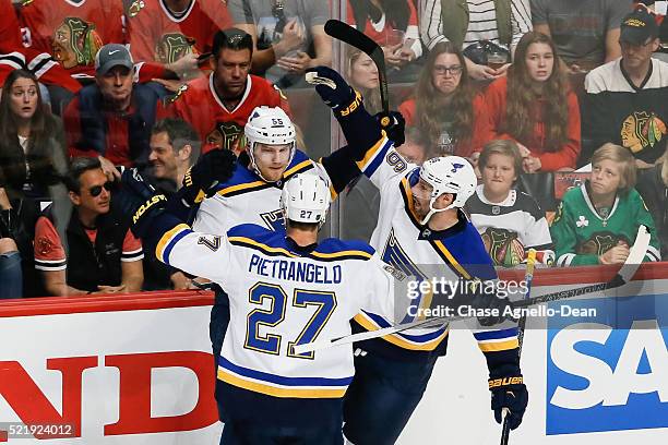 Colton Parayko of the St. Louis Blues celebrates with Alex Pietrangelo and Troy Brouwer after scoring in the first period of Game Three of the...